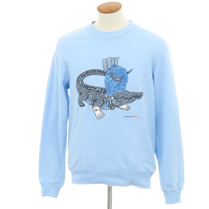 【中古】ラコステ LACOSTE × NETFLIX BRIDGERTON コットン クルーネック スウェット ライトブルー【 4 】【 状態ランクC 】【 メンズ 】